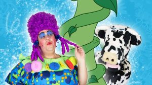 Pantomime dame and cow Buttermilk next to beanstalk